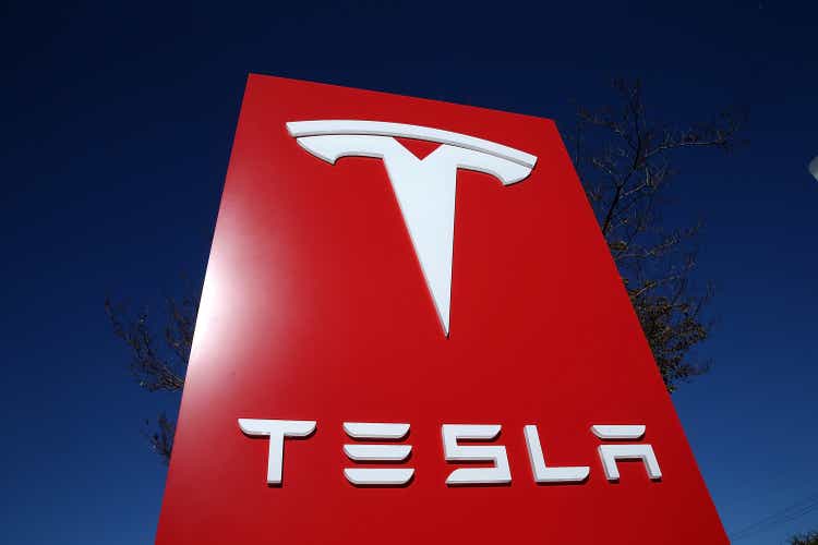 Electronic car maker telsa quarterly profit reports