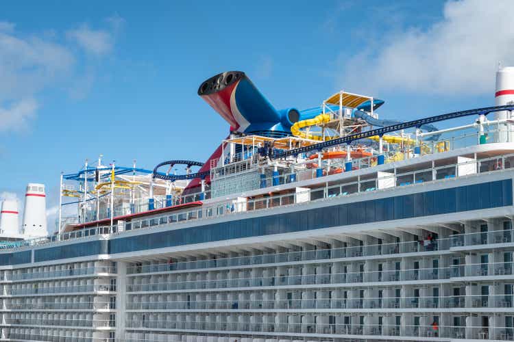 Carnival Celebration Cruise ship with roller coaster and water park docked in San Juan.