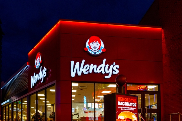 People in the Wendy"s restaurant at dusk in Niagara Falls, Ontario, Canada