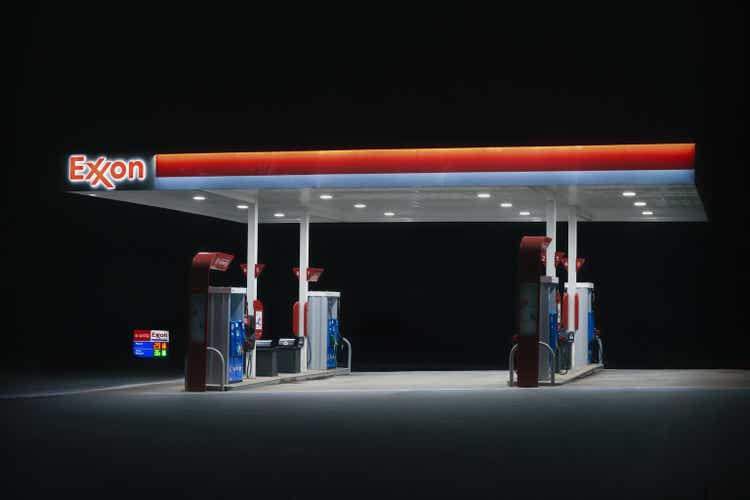 An Exxon gas pump area at night