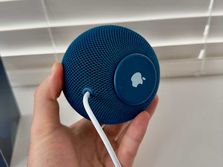 Closeup of a Blue Apple Homepod Mini on a white windowsill