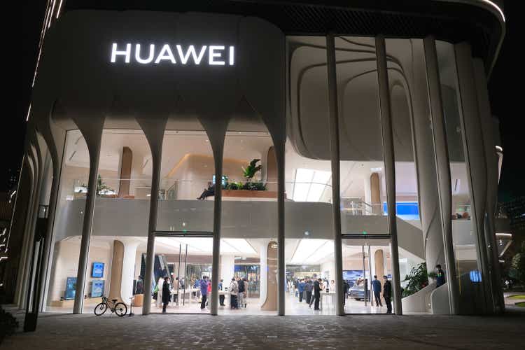 large HUAWEI flagship store with many customers