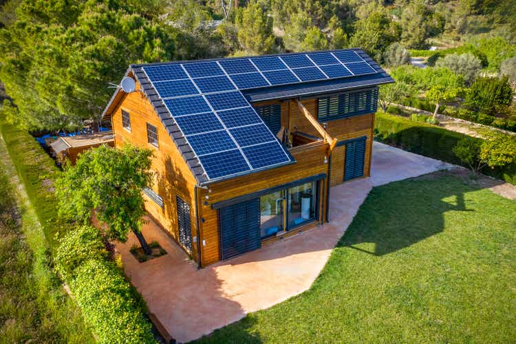 Solar photovoltaic panels on a wood house roof