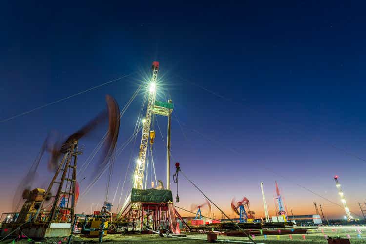 In the evening of oilfield derrick