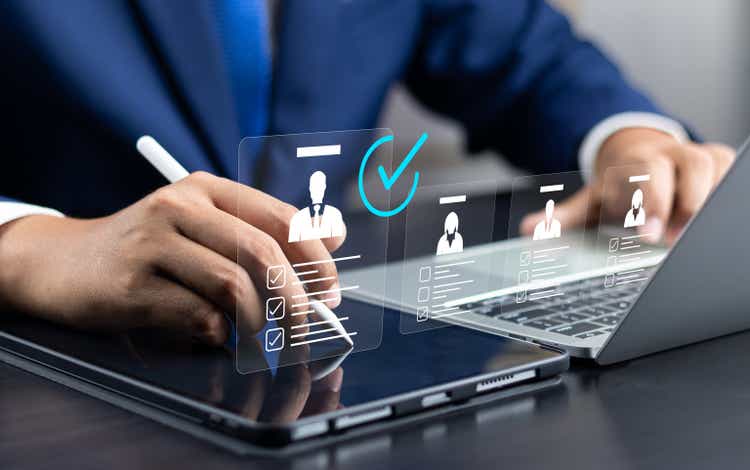 Human resource management technology (<a href='https://seekingalpha.com/symbol/HR' title='Healthcare Realty Trust Incorporated'>HR</a>), Human resource manager touching human resource network structure and checks the CV online to choose the perfect employee for company, Effective recruitment.