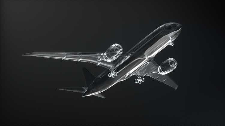 Glass 787 passenger plane taking off on carbon black background. Transportation concept. Bottom view.