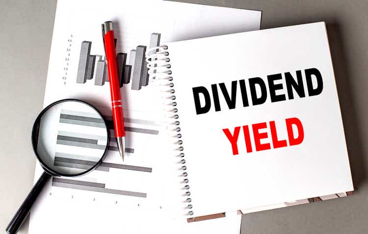 DIVIDEND YIELD text written on notebook with chart