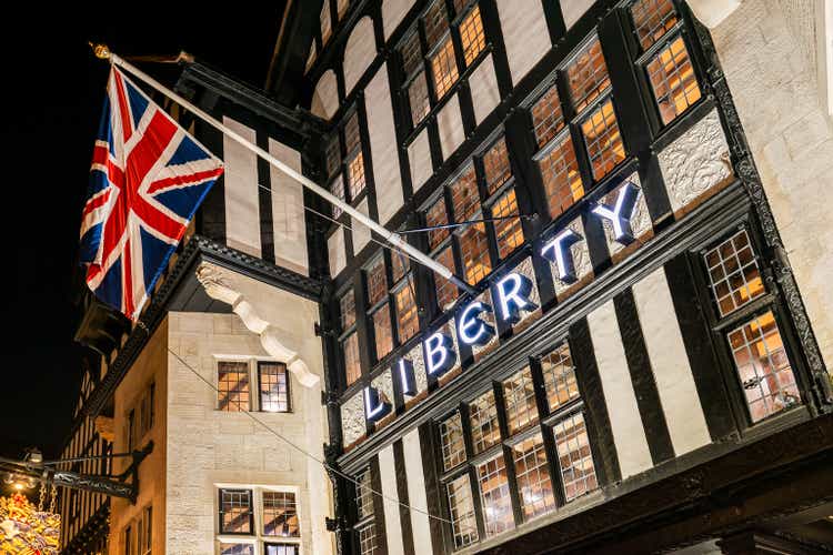 British flag and freedom sign at the entrance of famous department store in London, UK