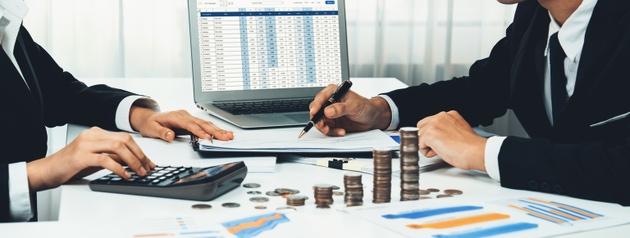 Corporate accountant and business investment stack coin. Shrewd