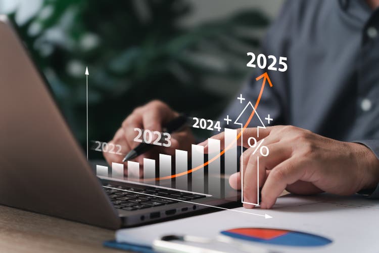 Business goal setting and target concept, Businessman use laptop plan financial analysis chart strategically for the new year calculating financial data for long-term investments.