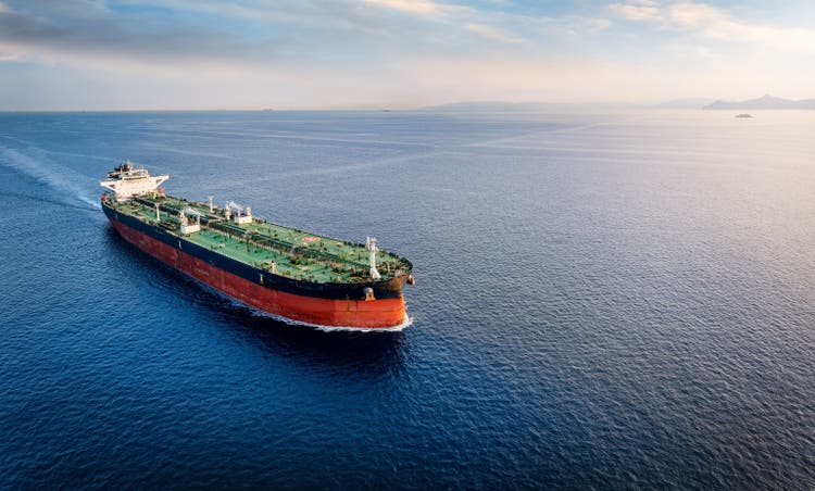 Aerial view of a large crude oil tanker traveling over open ocean