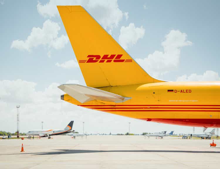 tail section of yellow DHL cargo aircraft (side view)