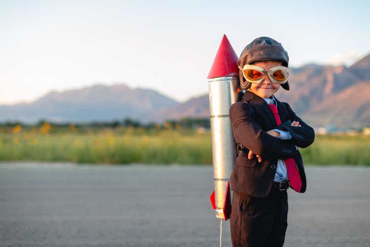 Young Boy Businessman Ready to Fly