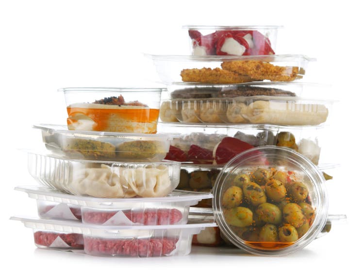 Variety of prepackaged food products in plastic boxes