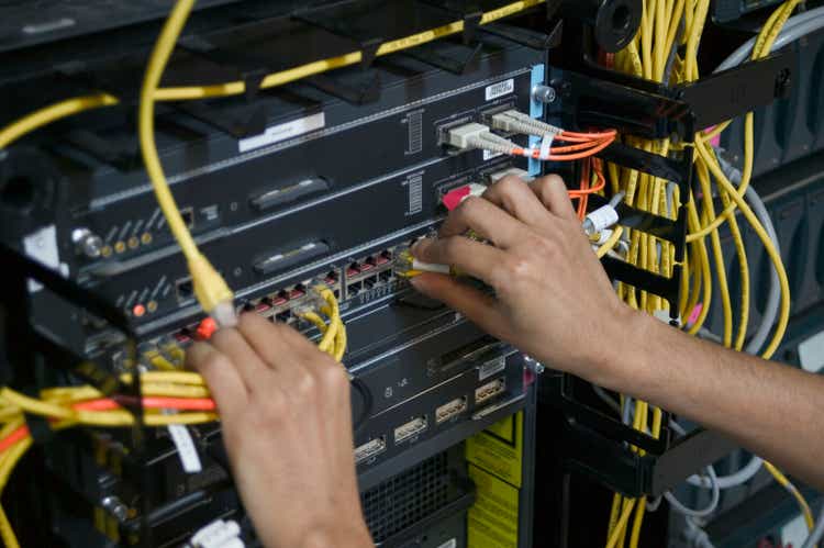 Man in sever room working with cables