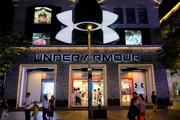facade of large Under Armour flagship retail store at night
