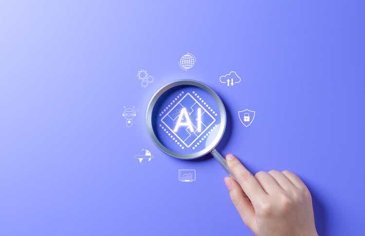 AI Artificial Intelligence technology concept. Hand holding magnifying glass focusing on AI chip on blue background. AI prompt generator, Machine learning, Marketing with chat robot, intelligent tech,