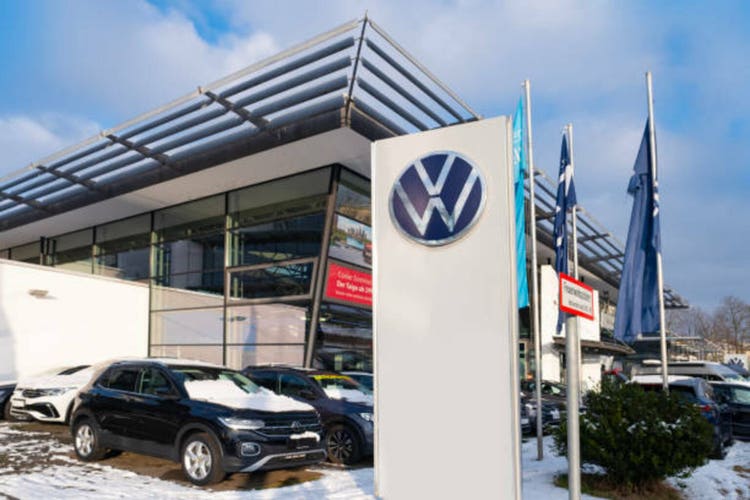 Advertising banners Volkswagen Group, German automobile manufacturer auto salon, Sales Office, corporation logo sign, company brand logotype signboard above entrance, Frankfurt - January 19, 2024