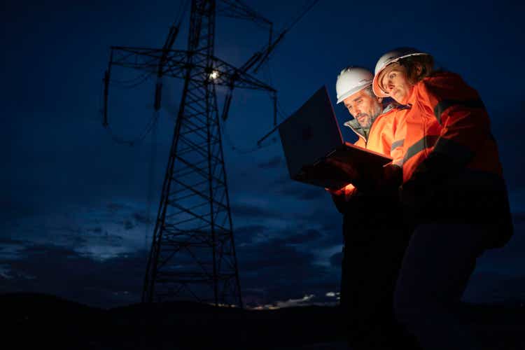 AI in Power Sector. Engineers night shift. Teamwork.