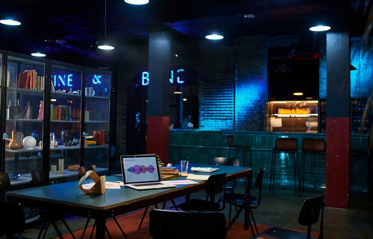 Laptop on desk in co-working office space