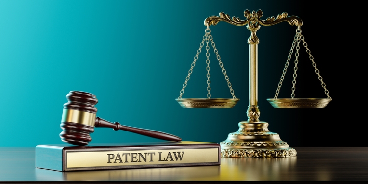 Patent Law: Judge"s Gavel as a symbol of legal system and wooden stand with text word