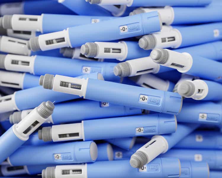 A large group of injectors / dosing pens for subcutaneous injection of antidiabetic medication or anti-obesity medication on a heap. Selective focus.