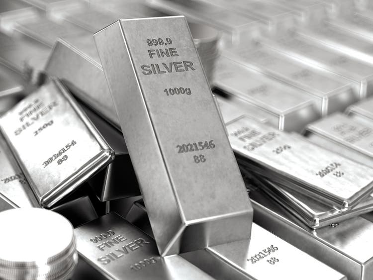 Stack of Shiny Silver Bars Ingots and Coins