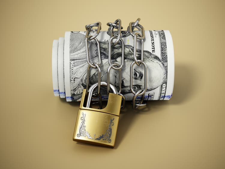 Chained and locked dollar bills. Financial security concept