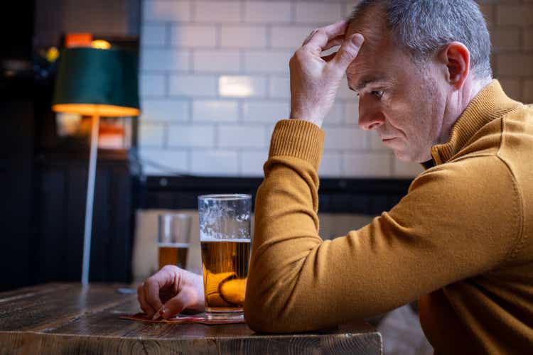 Upset Man in Bar Alone