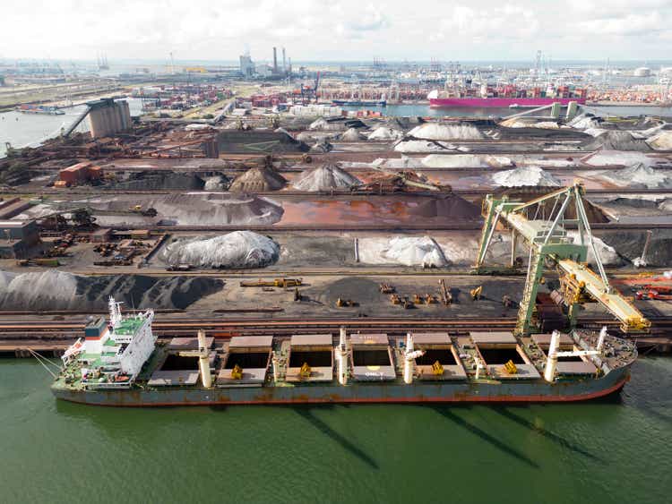 A large bulk carrier supplying iron-ore in a harbor