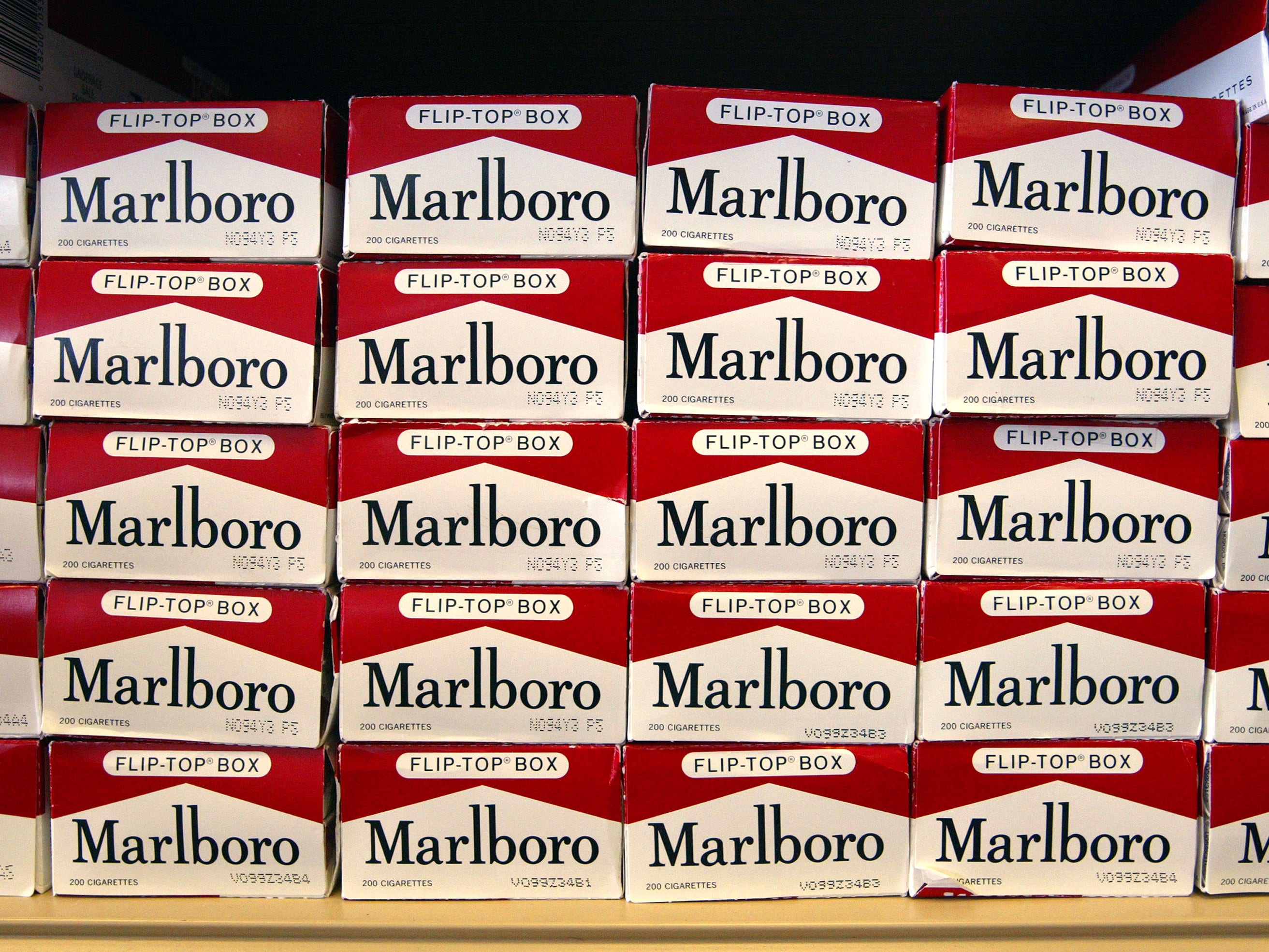 Marlboro maker cuts profit forecast as smokers swap to cheaper