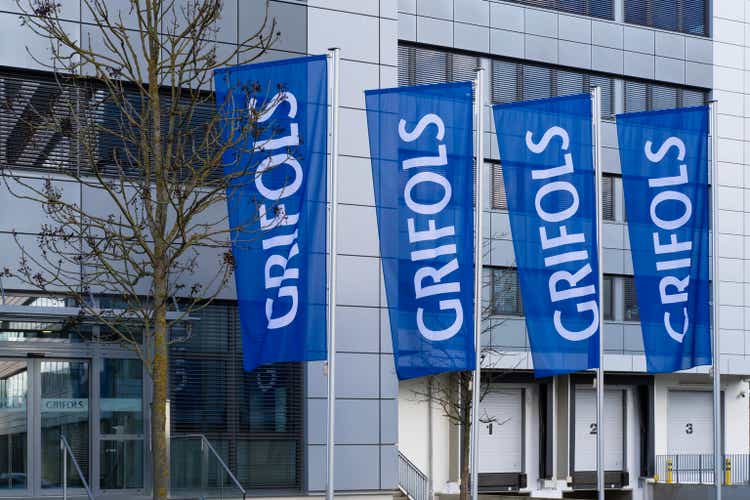 building with flags GRIFOLS in blue, global healthcare company develops plasma-derived medicines, innovative biopharmaceutical solutions, Grifols Deutschland GmbH Frankfurt - February 13, 2024