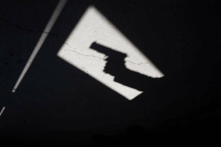 Shadow of a man with gun
