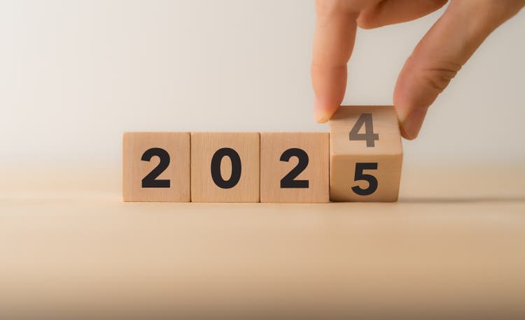 Starting new year 2025. Flipping of 2024 to 2025 on wooden cube blocks. Beginning and start of the new year 2024. Preparation for new year ,life, business, plan, goals, target and strategy concept.