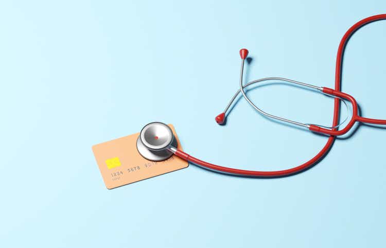 Stethoscope checking health of Credit card