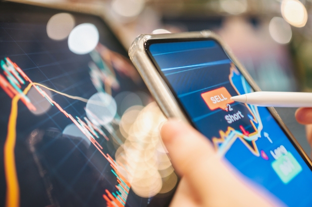 Close-up financial advisor using digital platform invest Etf and bond from digital app