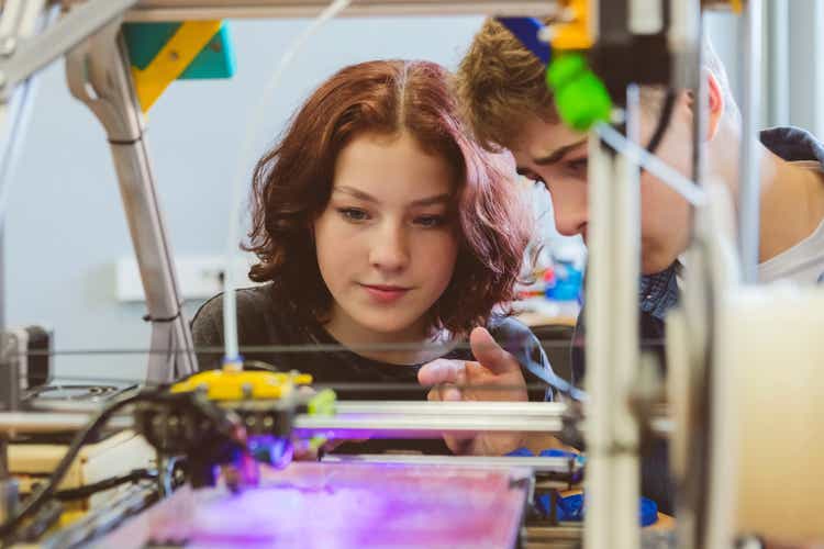 High school students watching 3d print