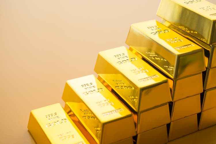 Stack gold bars as rise up stairs on yellow background.