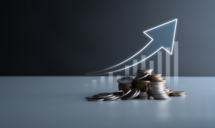 Financial trending increase in economy and business development, gold and silver coins stacking up with graphs. Increase in return on stock market, mutual funds, savings and long term investments.