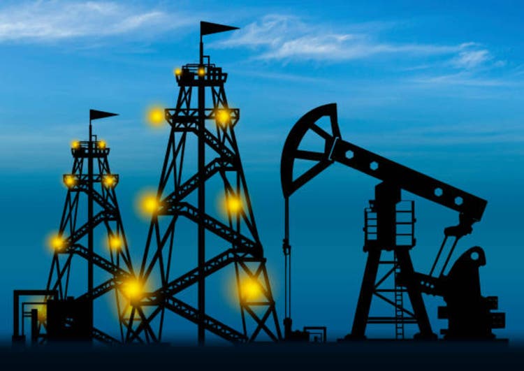 Oil and gas sector. Oil pump silhouette on sky background. Concept - petroleum exploration. Drilling rigs glow at night. Search for oil fields. Concept - petroleum production corporation.