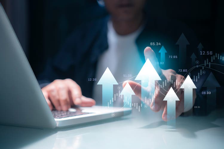 Business men are using technology to analyze data and invest in the capital market. and stock trading