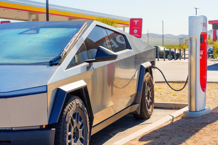 Tesla Cybertruck Foundation Series Being Charged at a Supercharger