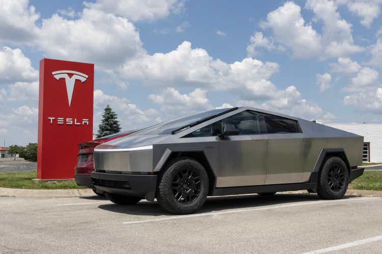 Tesla Cybertruck display at a dealership. Tesla claims the Cybertruck has a driving range of up to 340 miles. MY:2024