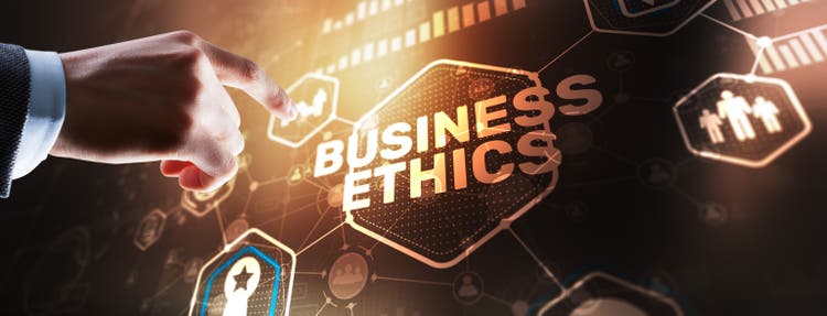 Business man writing business ethic concept on virtual screen