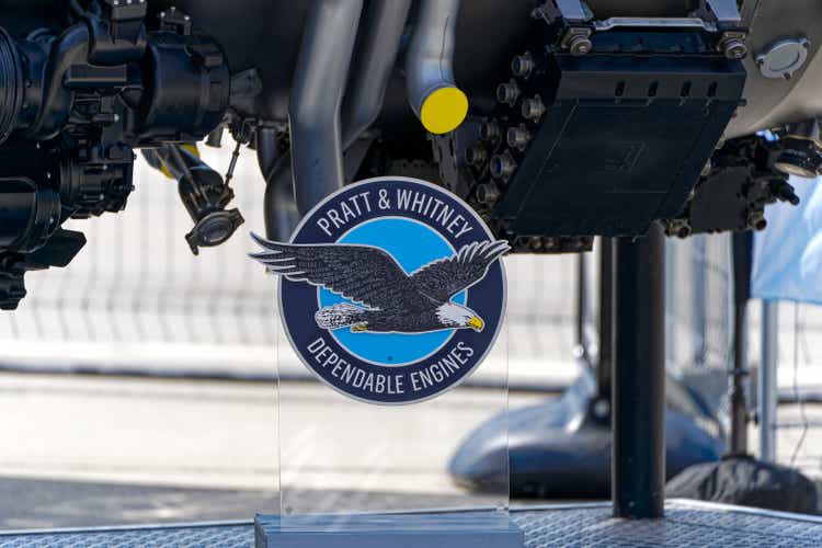 Logo of aircraft company Pratt & Whitney with eagle in front of fighter jet engine.