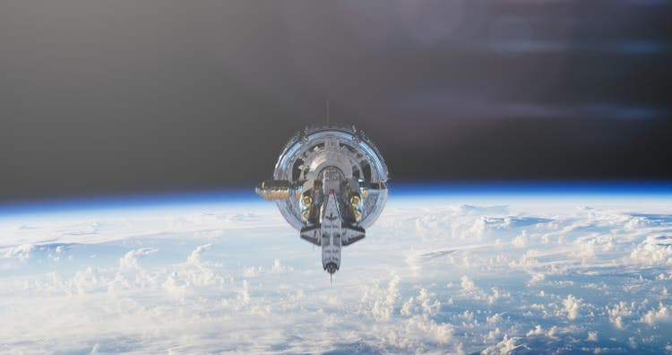 The space station completes its orbit against the Earth"s backdrop