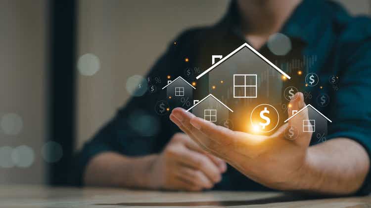 Real estate concept business, home insurance and property protection. Real estate investment concept. Buy and sell houses and properties online on a virtual screen.