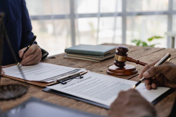 Lawyers provide legal advice. Represent clients in court and help with legal documents expert male lawyer discusses tax documents working in the office at a meeting legal consulting concept