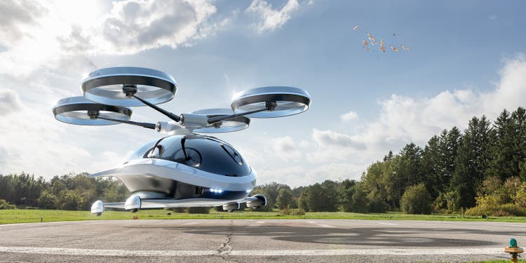 EVTOL Electric Vertical Take Off and Landing Aircraft Taking Off From Helipad