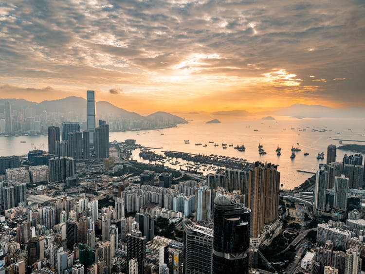 Hong Kong viewed from the drone with city skyline of crowded skyscrapers